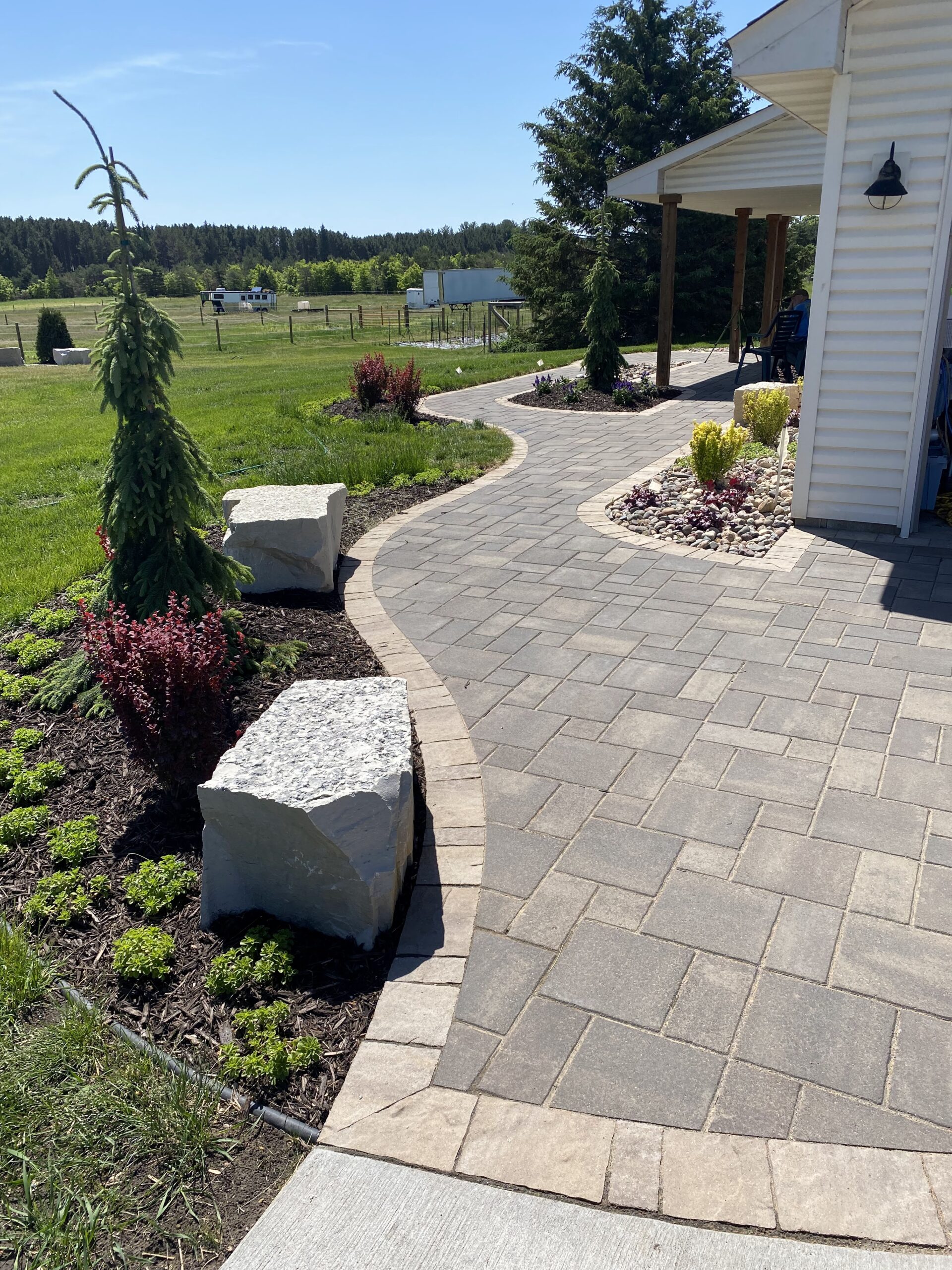 custom paved pathway with large rocks - Yellow Brick Road Pavers & Landscapes LLC