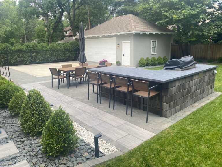 custom L Shape outdoor kitchen area with large stone pavers - Yellow Brick Road Pavers & Landscapes LLC